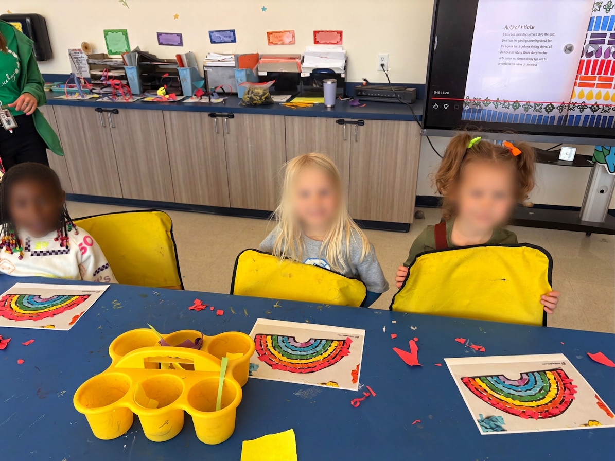 Little artists with their rainbow torn-paper collages