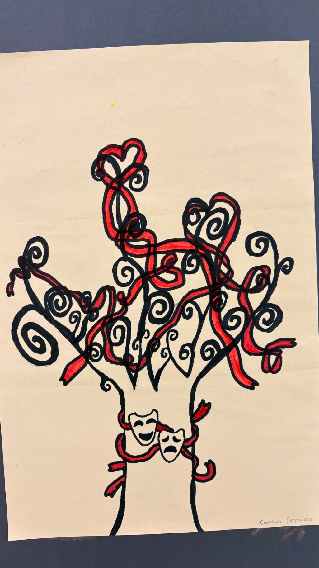 Swirling tree with theatre masks in black and red marker, by Cameron