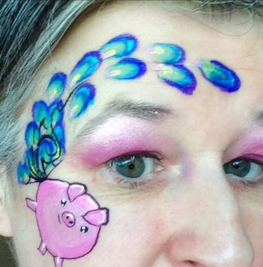 Whimsical pig and peacock-feather brow face painting design