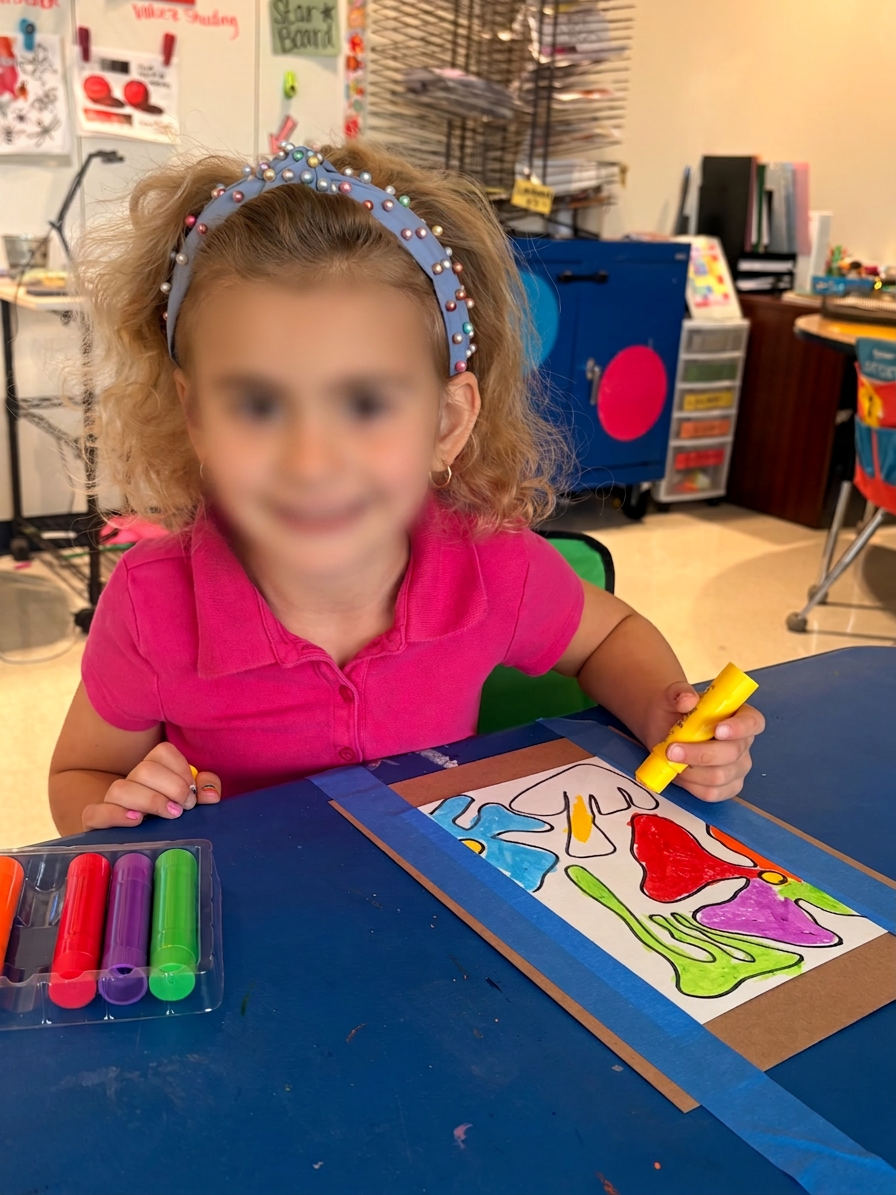 Young artist coloring a vibrant marker masterpiece
