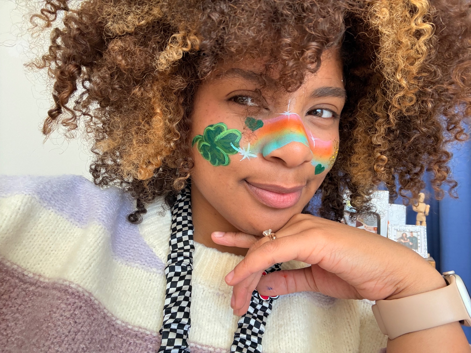 Shamrock and rainbow eye design with sparkle accents