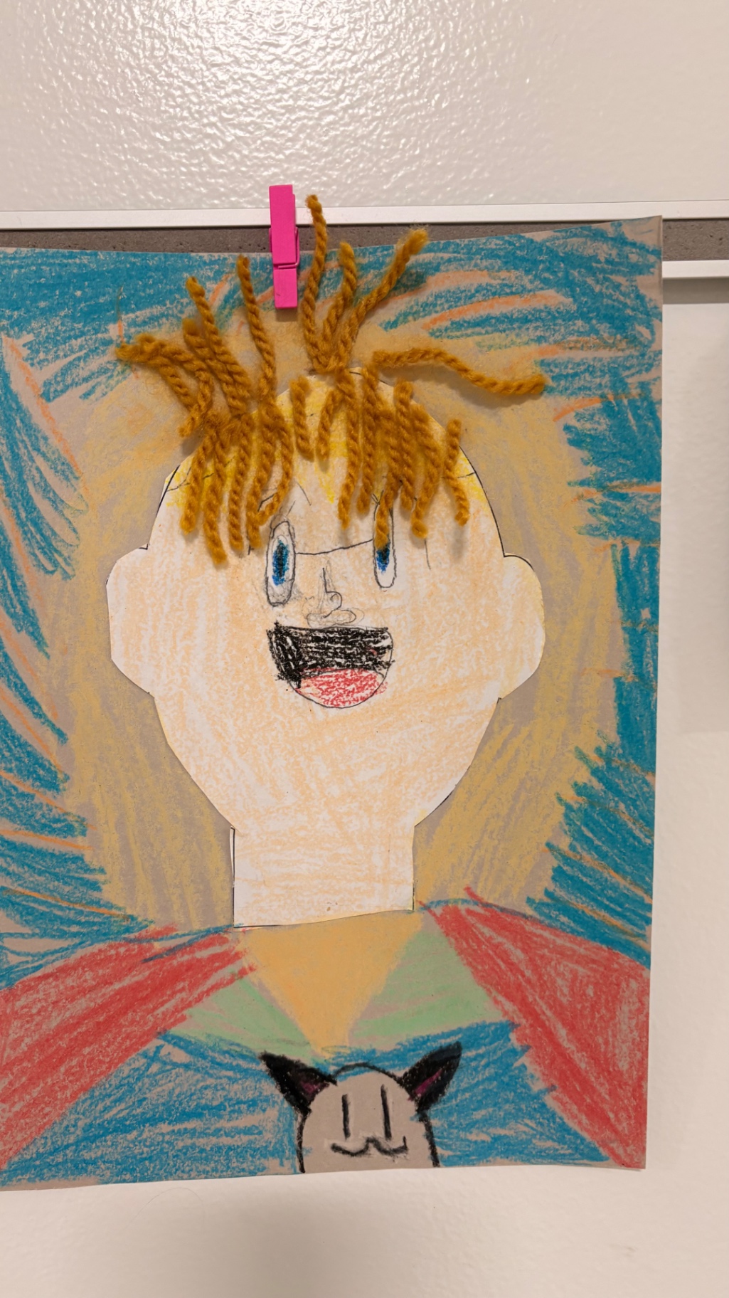 Mixed-media self portrait with yarn hair, by a young art student